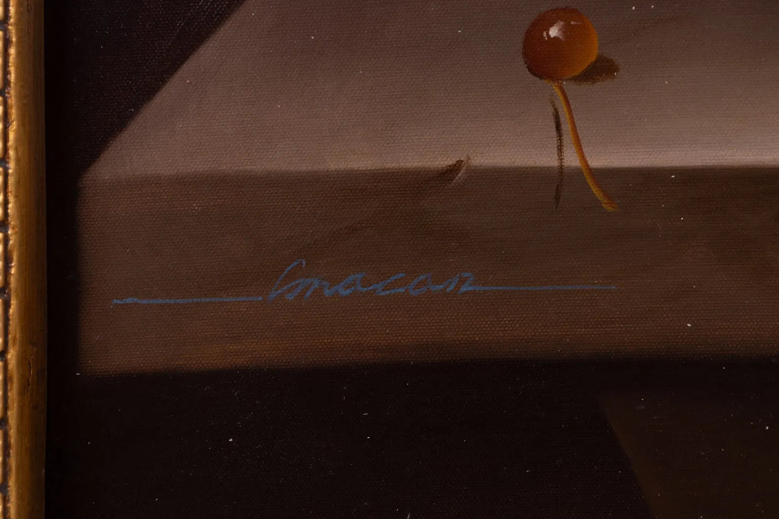 Close-up of a small mushroom with a signature on a brown background
