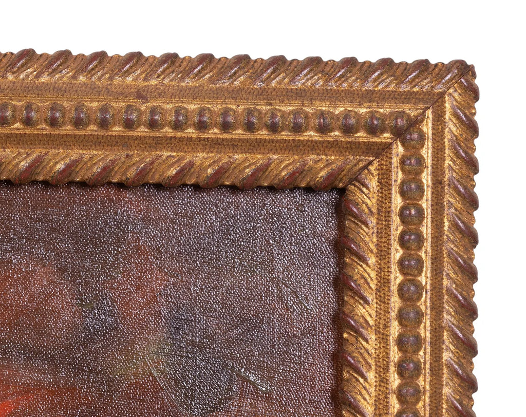 Close-up of a gold ornate picture frame with a textured surface.