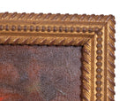 Close-up of a gold ornate picture frame with a textured surface.