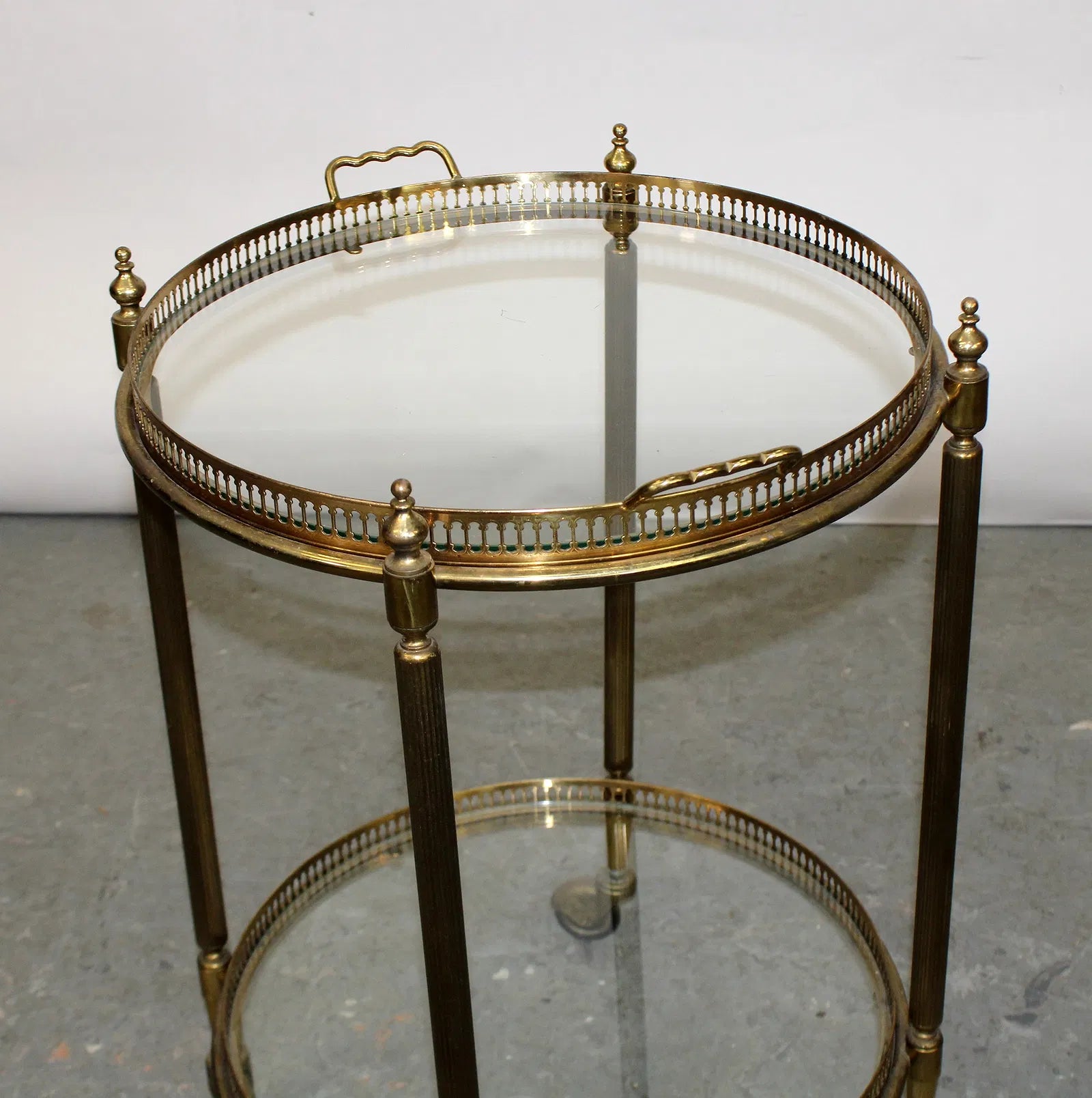 French brass and glass two tier round rolling bar cart