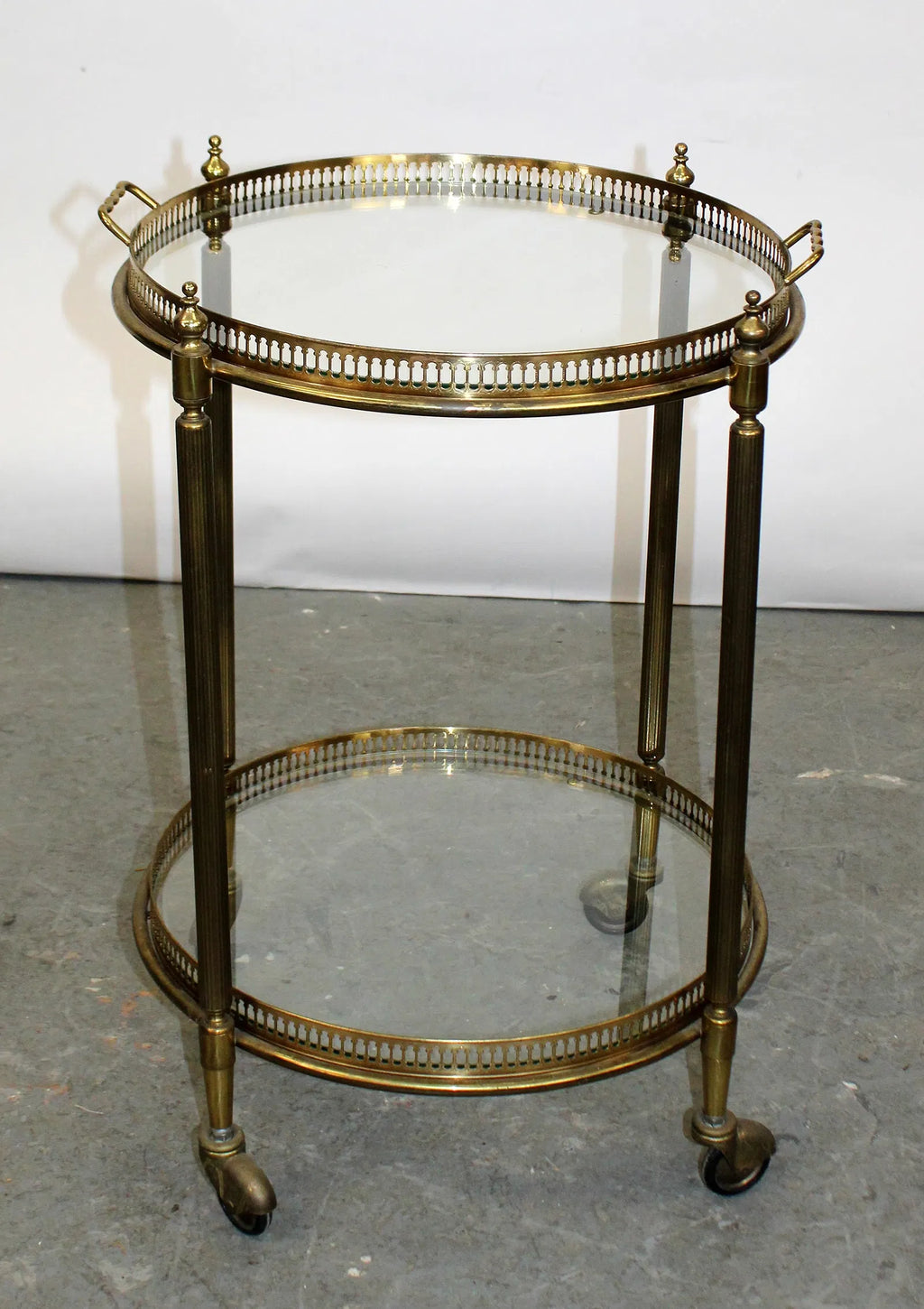 French brass and glass two tier round rolling bar cart