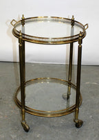 French brass and glass two tier round rolling bar cart