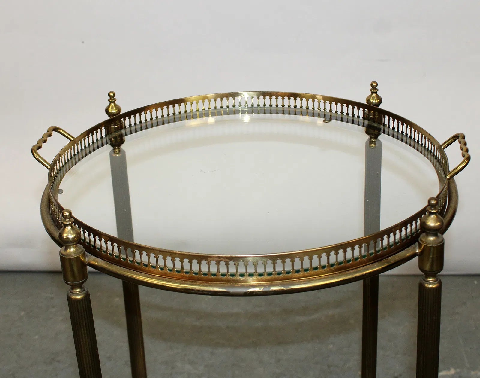 French brass and glass two tier round rolling bar cart