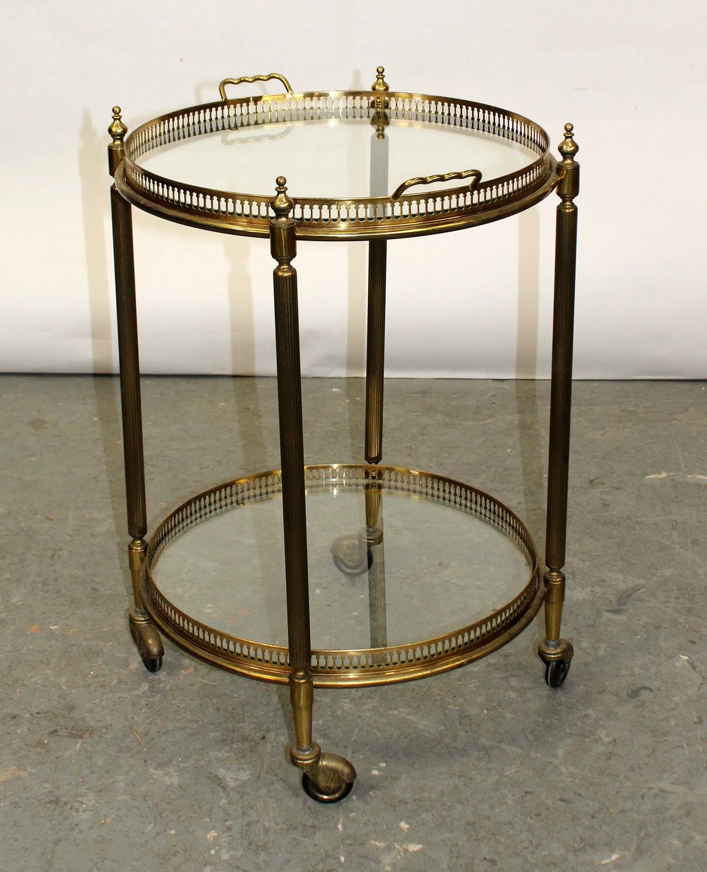 French brass and glass two tier round rolling bar cart