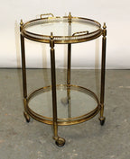 French brass and glass two tier round rolling bar cart