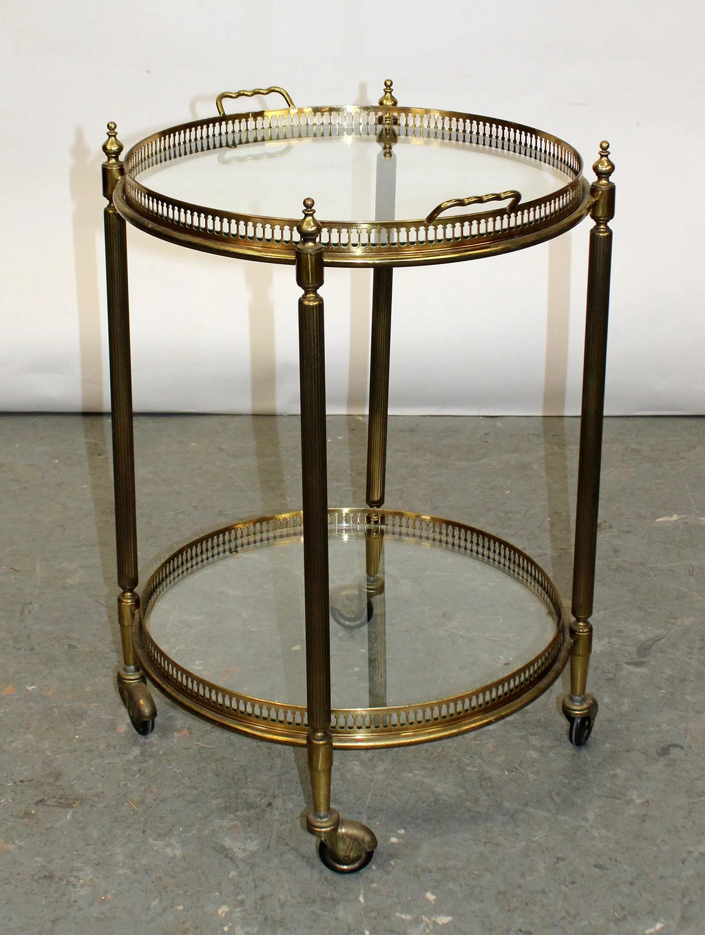 French brass and glass two tier round rolling bar cart