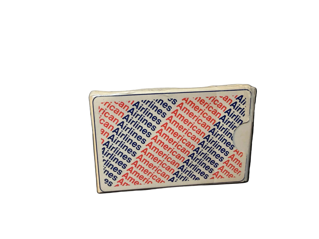 Small rectangular sign with 'American Airlines' text on a white background