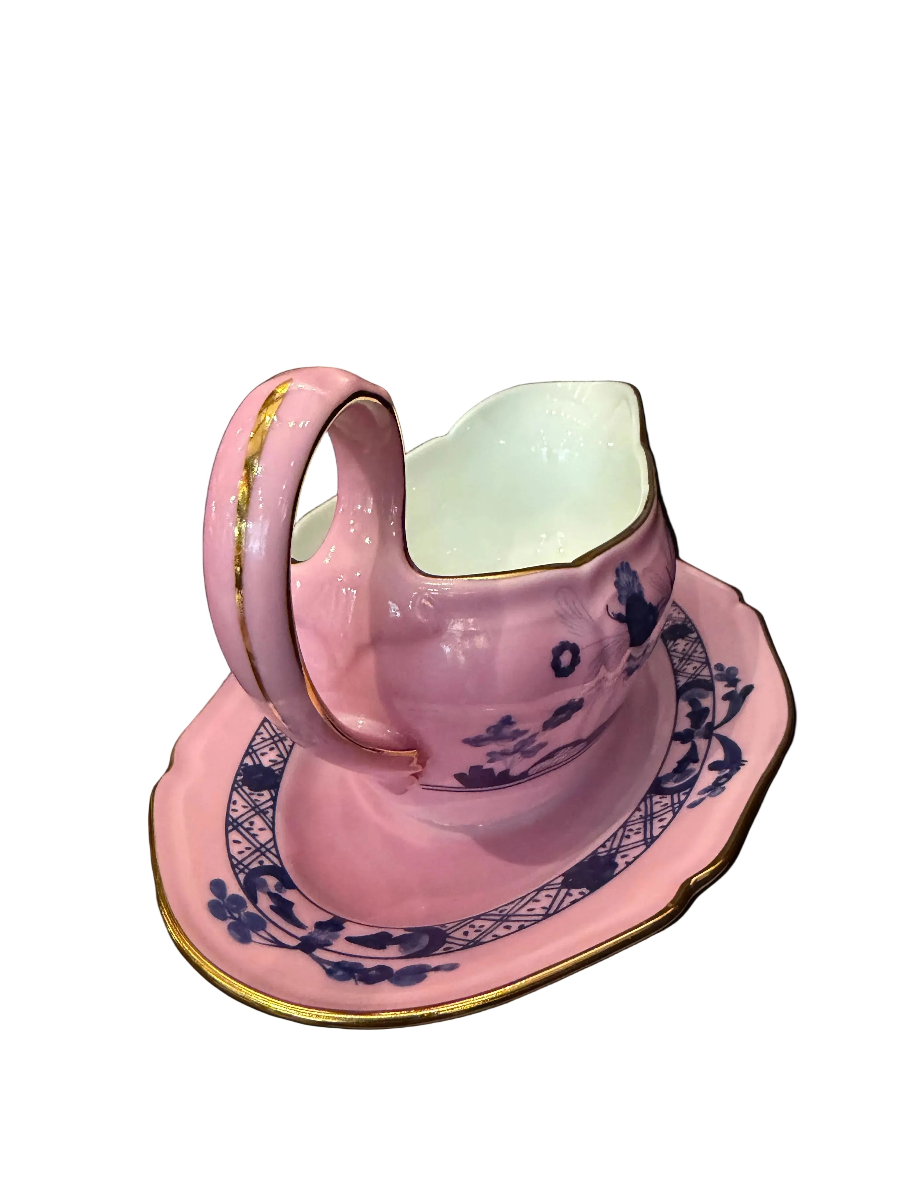 Pink and blue decorative item on a wooden surface